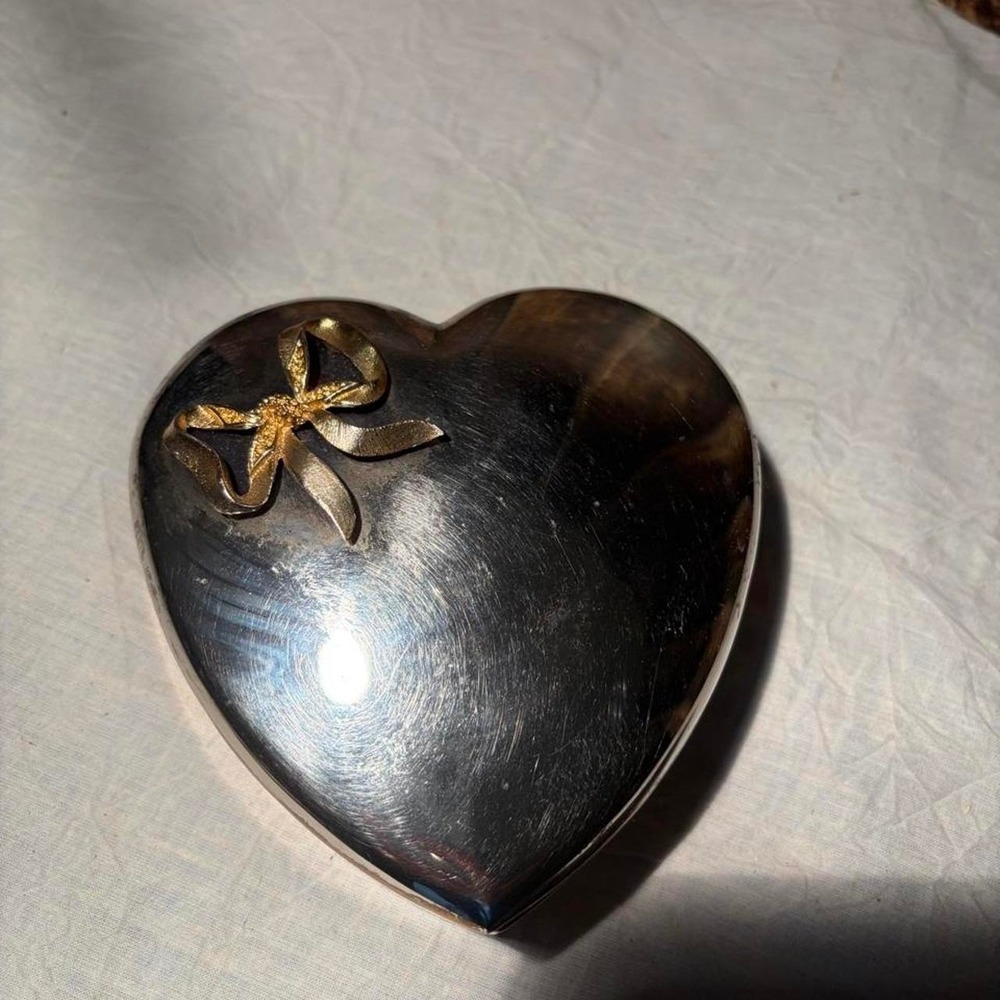 Vintage silver heart-shaped trinket box with gold bow